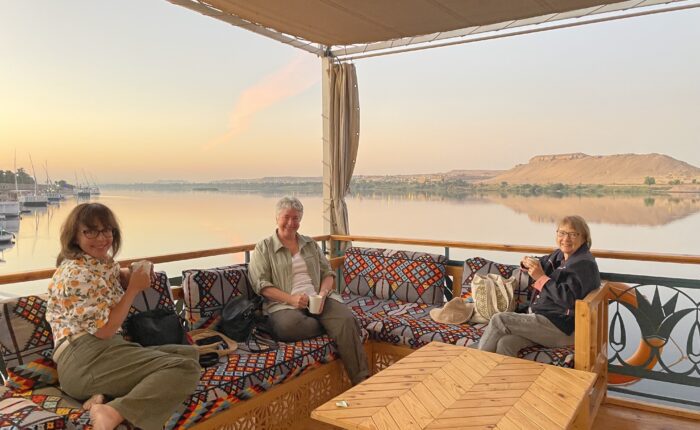 Boutique travel in Egypt: Three travelers enjoy an uncrowded Nile River experience aboard a traditional dahabiya sailboat
