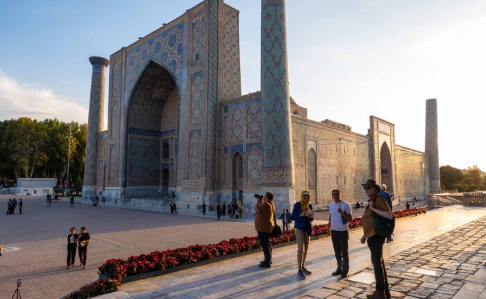 Small group archaeological tour at Samarkand with scholar guide discussing Islamic architecture