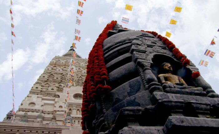 The Mahabodhi Temple at Bodh Gaya, Bihar, prayer flags and marigold garlands against the spire